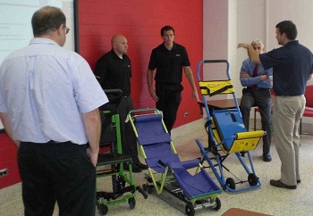 Members of the Emergency Stair Travel Devices Committee with equipment Members of the Emergency Stair Travel Devices Committee with equipment
