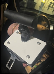 Close up of buckle side installed showing T-handle and "sandwich" electrical cover design.