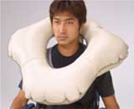 Picture of a person wearing the inflated &ldquo;flower-shape&rdquo; harness over the shoulder designed to protect occupant&rsquo;s head during forward/backward/sideway falls 