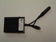 Image shows the overhead view of the rectangular SPDT pedal with cover closed. A &frac14;” female stereo cable and a 1/8” female mono cable extend out from the front of the pedal.