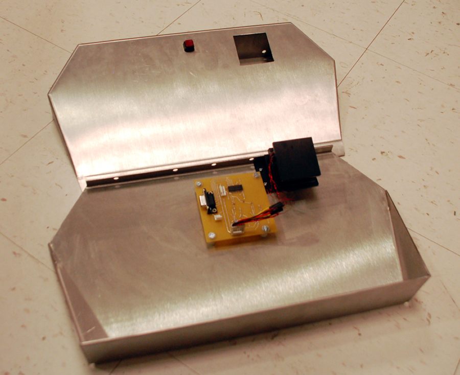 Figure 4 combines our printed circuit board, sensor block and steel footplate into one integrated piece. The footplate is left unscrewed so that the other components are visible.