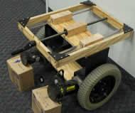 Figure 2. Perspective engineering drawings of the variable position mid
wheel drive system. Top-double screw system and crank handle,
bottom-track
system to provide rigidity.